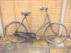 A 1927-28 James bicycle: step through frame with frame mounted Sturmey Archer three speed gears,