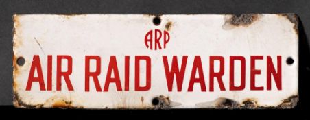 A WWII enamel door sign 'ARP. Air Raid Warden': red text on white ground, 7.6 x 22.7cm.