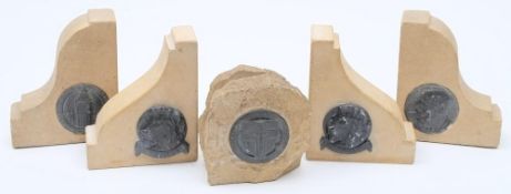 Two pairs of Parliament stone bookends and a Parliament stone letter holder: each with circular