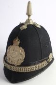 A Glamorgan Constabulary blue cloth helmet: of six panels with plated reeded finial and cross