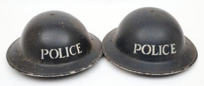 Two WWII Mk II pattern Police steel helmets: both in blue with stencilled 'Police' to front,
