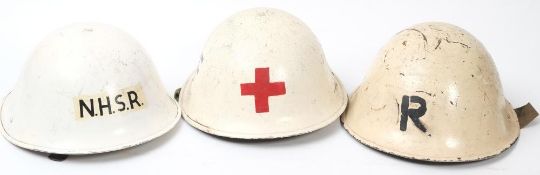 A post war National Health Service Reserve Mk III 'turtle' steel helmet: white with 'NHSR' to front,