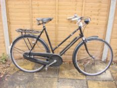 A 1950s Rudge Whitworth Sports bicycle: black step through frame with original decals,