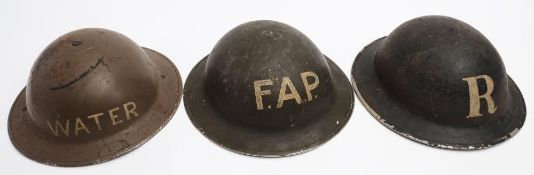 A WWII Mk II First Aid Party (FAP) steel helmet by Fisher & Ludlow Ltd: green with white text,