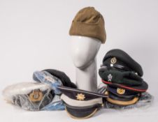 A group of various Officers' peaked caps and other rank hats: including a Royal Engineers peaked