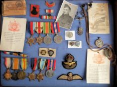 A framed family group of WWI & WWII medals: comprising a WWI trio to '04037 Pte H Whitfield AOC',