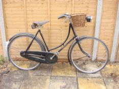 A 1930s Humber Sports lady's bicycle: black step through frame with gilt lettering,