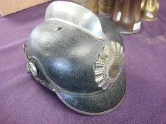 An early 20th century German black leather fire helmet by J R Lieb,