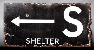 A WWII enamel Air Raid Shelter sign 'S Shelter' with direction arrow: white text on black ground,