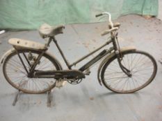 An early 20th century Sun bicycle: step through frame, plated handlebars, bar brakes, rear pannier,