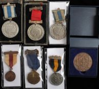 A group of six early 20th century School Attendance medals: including one for Eton College and a