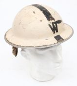 A WWII Head Warden Mk II steel helmet: white with black stripe and 'W' front and back,