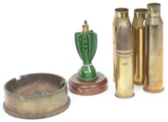 A collection of WWI No 101 fuses: together with a WWII trench art ashtray and a collection of shell
