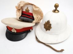 A Royal Marines Wolseley Pattern pith helmet with gilt pommel and badge: together with two Royal