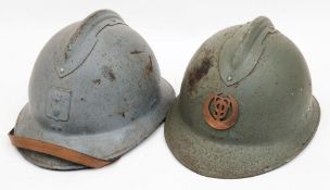 A WWII French Artillery M26 Adrian steel helmet: painted light blue with attached comb and helmet