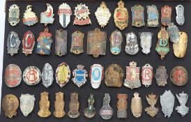 A framed group of forty-five bicycle manufacturers name plates: including BSA, Paris, Rudge,