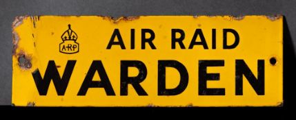 A WWII enamel door sign 'ARP. Air Raid Warden': black text on yellow ground, 7.6 x 22.7cm.