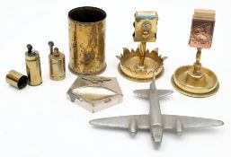 Two WWI Trench Art smokers' companions: together with a shell case, two petrol lighters,