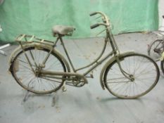 A Raleigh all steel bicycle: step through frame with frame mounted Sturmey Archer three speed gears,
