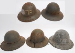 A group of five WWII period Zuckerman pattern 'Civilian Protection' steel helmets: various makers