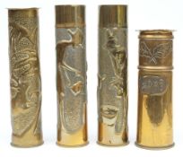 A pair of Trench Art vases: with stipple ground and repousse decoration,