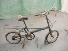 A Moulton MK 3 bicycle:, blue frame with decal, plated handlebars, Sturmey Archer three speed gears.