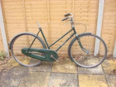 A Hercules 'Balmoral' lady's bicycle,: original green step through frame with decals,