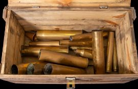 A collection of WWII and later shell cases in an associated wooden armour case: (a lot)