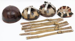 A mid 20th century bakelite Dispatch rider's helmet liner: with leather nape and chinstrap,