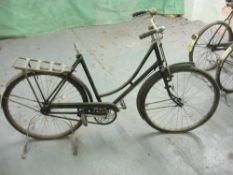 A Raleigh all steel bicycle: step through frame with plated handlebars, bar brakes,