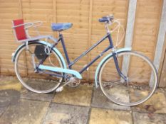 A 1960s BSA lady's bicycle: two tone blue step through frame, plated handlebars,