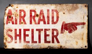 A WWII enamel 'Air Raid Shelter' sign: with pointing hand, red on white ground, 25.