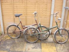 A BSA Shopper bicycle together with a Raleigh Stowaway bicycle: (2)
