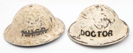 A WWII National Health Service Reserve (NHSR) Mk II steel helmet: white with the letters 'NHSR' to
