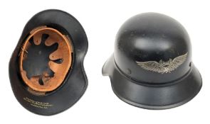 A WWII German Luftschutz Gladiator pattern steel helmet: of one piece construction,