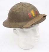 A WWII Mk II pattern Bomb Disposal steel helmet: green with red letters 'BD' either side of a
