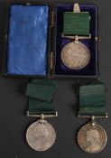 Three Victorian Volunteer Long Service Medals: one unnamed in case, one named 'Pte W Smith',