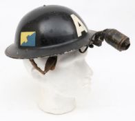 A WWII Mk II 2A pattern Ambulance Driver/Attendant steel helmet with brass lamp: the black helmet