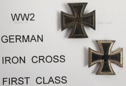 Two WWII German Iron Crosses, First Class: one stamped to reverse with Reichszeugmeisterei.