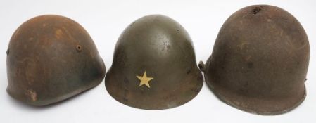 An American M1 pattern steel helmet: (poor condition) together with a Chinese steel helmet and a
