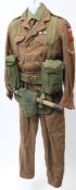 A post war (1953) 1943 pattern Battledress Blouse and trousers: with canvas rucksack and trenching