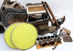 A collection of various militaria: including a WWII Infant gas mask, two trenching tools,