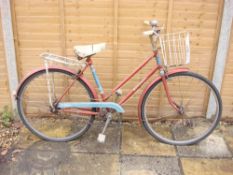 A BSA Bermuda lady's bicycle: red and blue step through frame,
