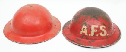 Two post WWII Auxiliary Fire Service Mk II steel helmets: both in red one marked 'AFS' to front,