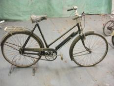 A New Hudson lady's bicycle: black step through frame with plated handlebars, bar brakes,