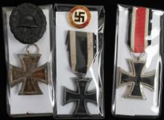 A battlefield relic Iron Cross: together with two reproduction Iron Crosses,