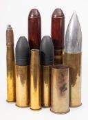 A collection of WWI and later shell casings: including a WWI German 8pdr shell case dated 1914