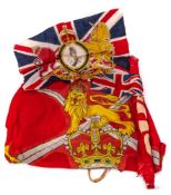 A George VI red cloth banner 'God Save The King': 90 x 180cm (holed and worn),