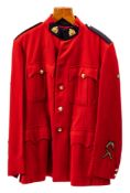 A Royal Canadian Mounted Police Red Serge jacket: with five years service star,