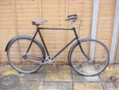 A 1950s Gazelle gentleman's bicycle: black frame with plated bars and crank, three speed rear hub,